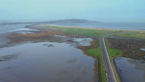 Peninsula Road Divides Ocean and Marshland from Above