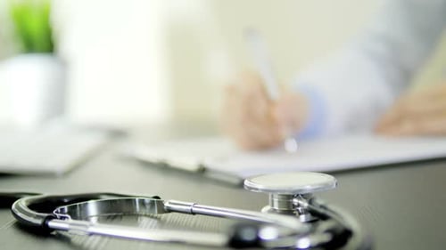 Stethoscope on Doctor's Desk in Hospital Office