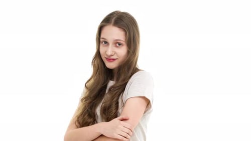 Young Woman Smiles Confidently on White Background