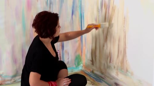 Woman Creating Abstract Painting on Wall