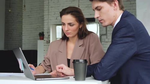 Business Meeting at Desk With Laptop and Coffee