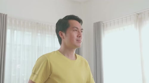 Man in Yellow Shirt Indoors in Bright Room