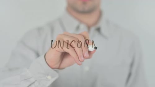 Writing UNICORNO on Clear Surface with Marker