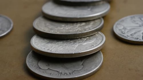 Antique Silver Coins Stacked on Surface