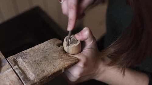Crop woman working on creation of jewelry