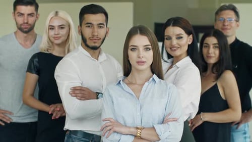 Confident Business Team Poses in Office Environment