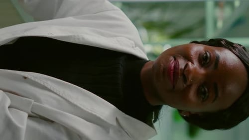 Smiling Woman in Lab Coat Close Up