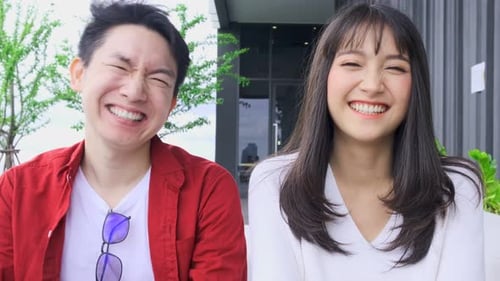 Smiling Young Couple Laughing and Having Fun