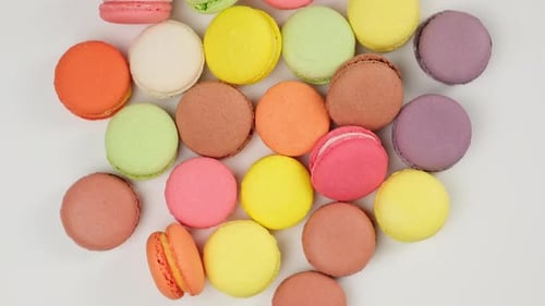 Overhead Shot of Colorful Macarons on White Surface