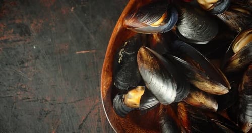 Delicious Mussels on a Wooden Plate