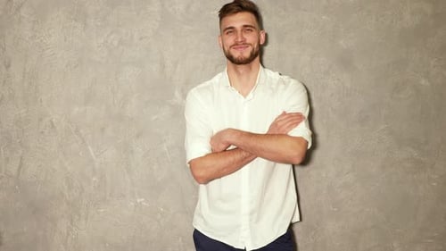 Handsome Man Posing Indoors with Arms Crossed