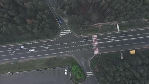 Aerial drone view of highway road with moving cars. Modern speedy highway with road markings