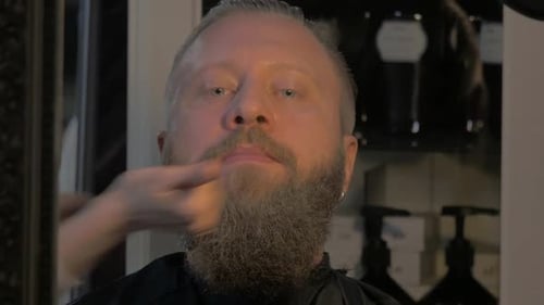 Adult Man with Beard Getting a Facial Massage