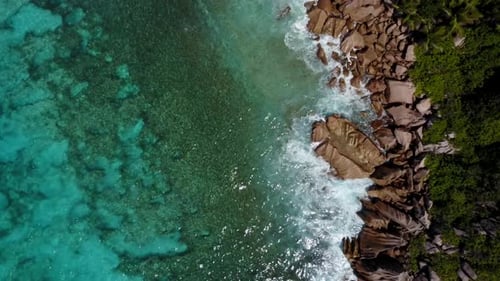 Aerial View of Tropical Coastline with Crashing Waves