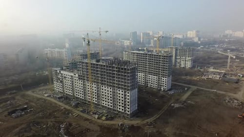 An aerial view of a large construction zone in a residential area