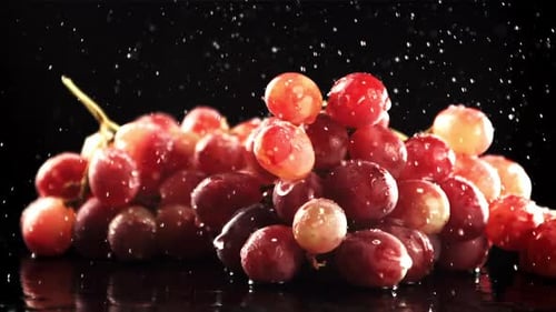 Drops of Water Fall on Fresh Grapes