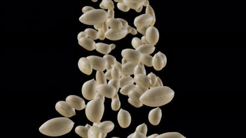 Animated Peeled Peanuts Falling on Black Background