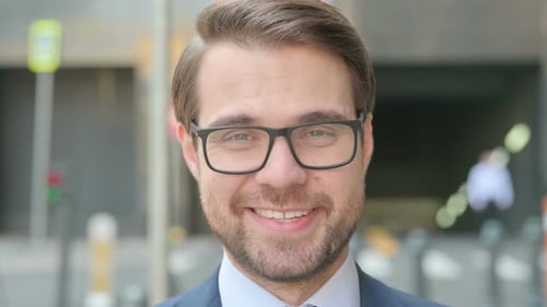 Face Close up of Businessman Smiling at Camera