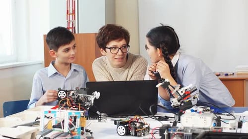 Students Building Robots Together in Science Classroom