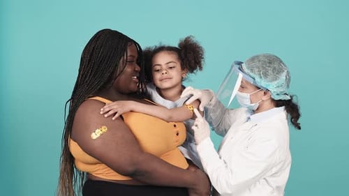 Child Receives Vaccine in Medical Setting