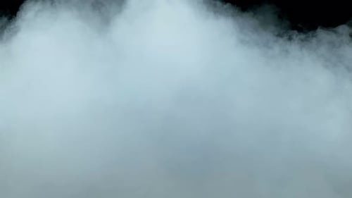 Swirling Blueish-White Vapor Against Black Background