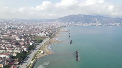 Coastal Cityscape with Sandy Beach Aerial View