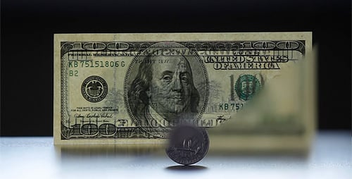 Coin And 100 Dollar Bill