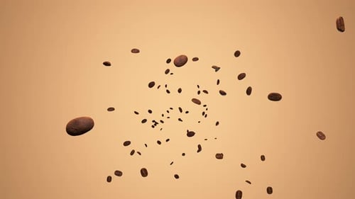 Granos de
café que caen y giran lentamente.