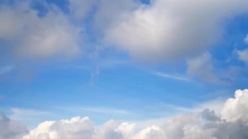 Clouds Drifting Slowly Across a Blue Sky