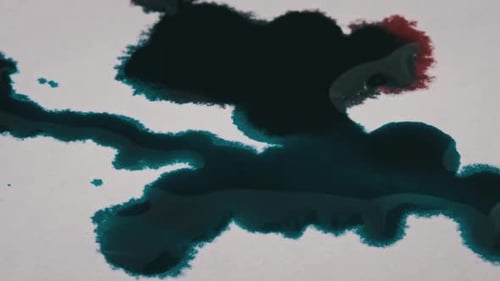 Spreading Red and Blue Ink on White