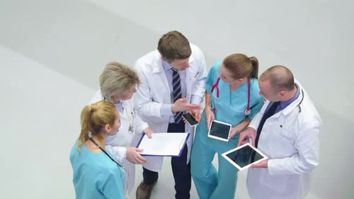 Medical Team Meeting with Technology in Hospital