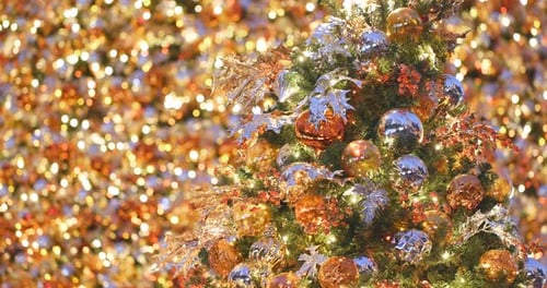 Decorated Christmas Tree with Twinkling Golden Background