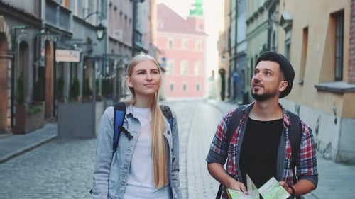 Couple Touring Old City Streets with Map