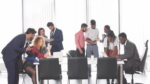 Diverse Professionals Collaborate in Modern Office Setting