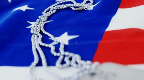 Dog Tags on American Flag for Memorial Day