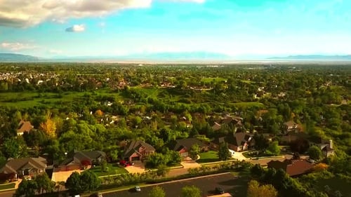 A floating drone shot over a small suburb part of Utah.