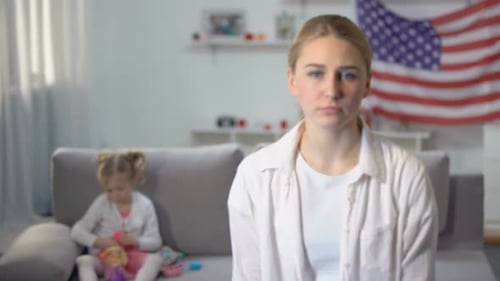 Woman and Child with American Flag Backdrop
