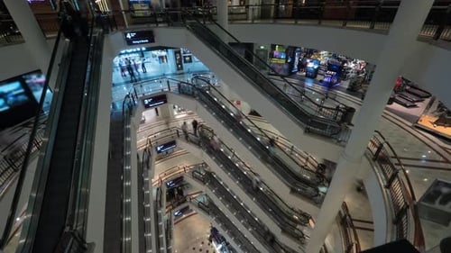 Timelapse of People on Escalators in Multistorey Shopping Mall