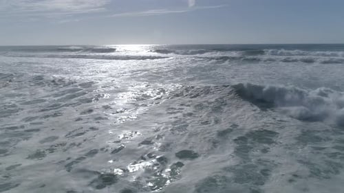 Aerial View of Waves Crashing on Coast