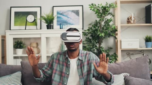 Man with VR Headset Interacting with Virtual World