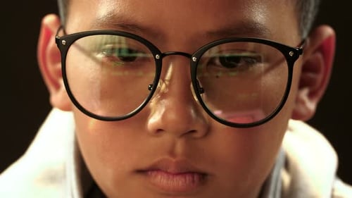 Face Of Asian Boy Hacking Computer System