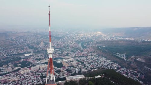 Transmit Mast On The Hill Over The City Aerial