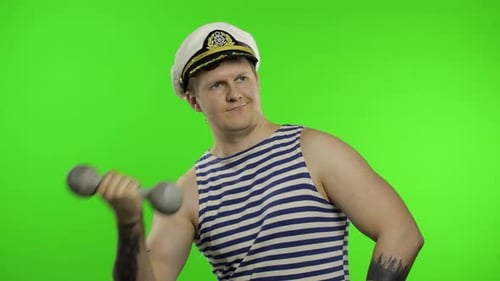 Sailor Man Making Weightlifting with Dumbbell. Seaman Guy in Sailor's Vest
