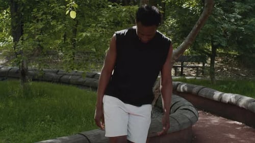 Sporty African American Man Juggling A Soccer Ball Training Outdoors