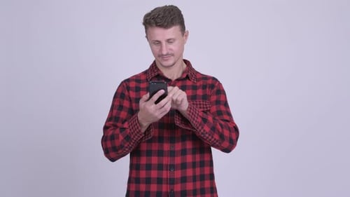 Man Using Smartphone Wearing a Flannel Shirt