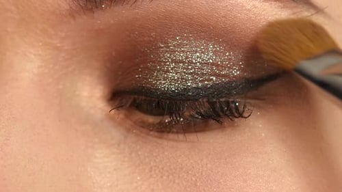 Girl with Makeup Brush. Close Up. Slow Motion
