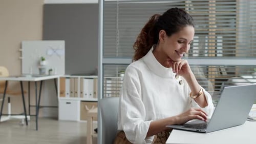 Attractive Businesswoman Working in Modern Office
