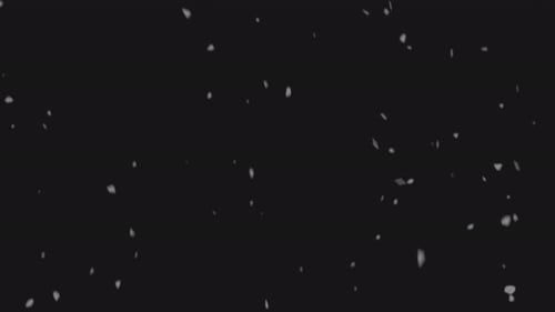 Fallender Schnee in langsamer Geschwindigkeit vor schwarzem Hintergrund