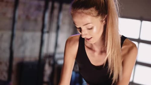 Woman Working Out Hard at the Gym