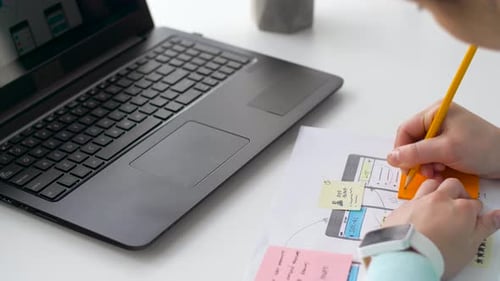 Person Developing User Interface for Mobile Application